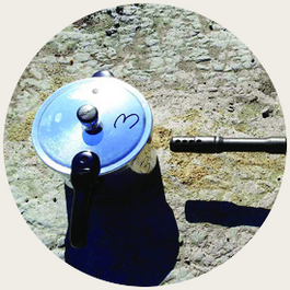 Pressure cooker device with the disrupter barrel trained on it from stand-off