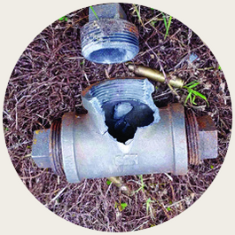 Pipe bomb opened along its length after a disrupter shot, end cap separated