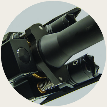 Close view of the self-contained recoil absorption assembly behind the disrupter barrel